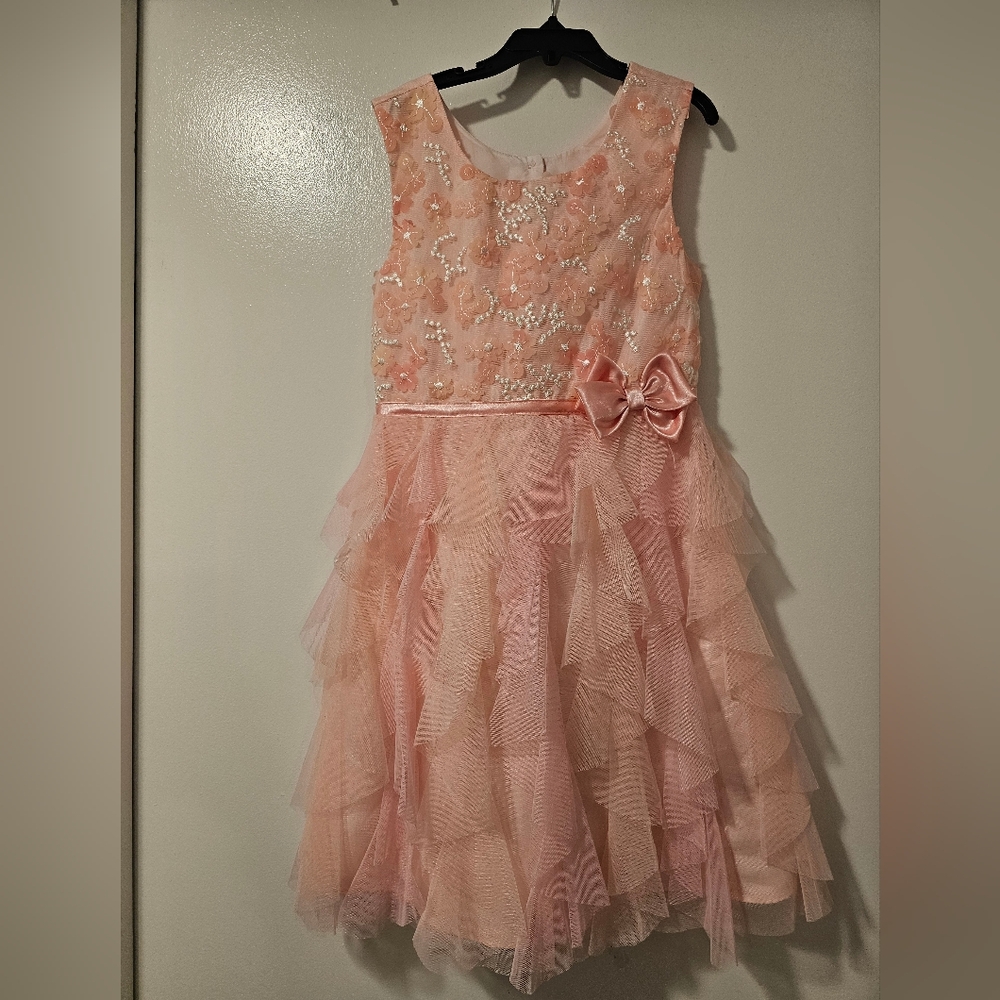 Jona Michelle pink with flower decor and bow on the side